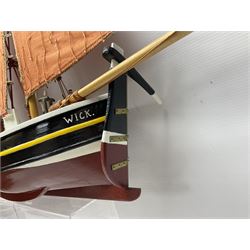 Wooden model of the Peterhead Herring Fishing Boat, Love Divine, PD404. on stand together with Wick Herring Fishing Boat, Galilee WK.1. on stand, L105cm, H64cm