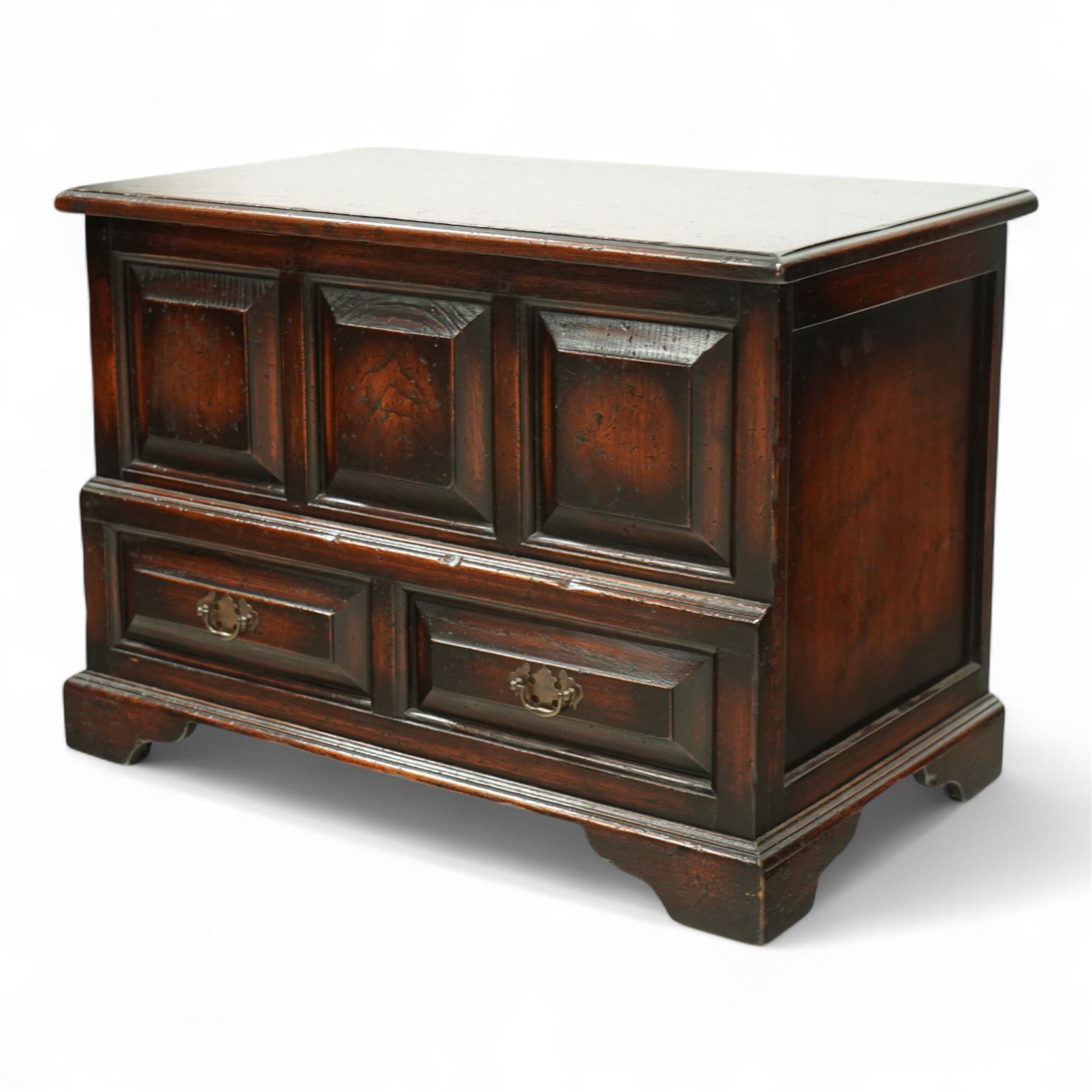 Titchmarsh and Goodwin design miniature oak coffer, rectangular, removable top with projecting panelled front with blind drawers on bracket feet 