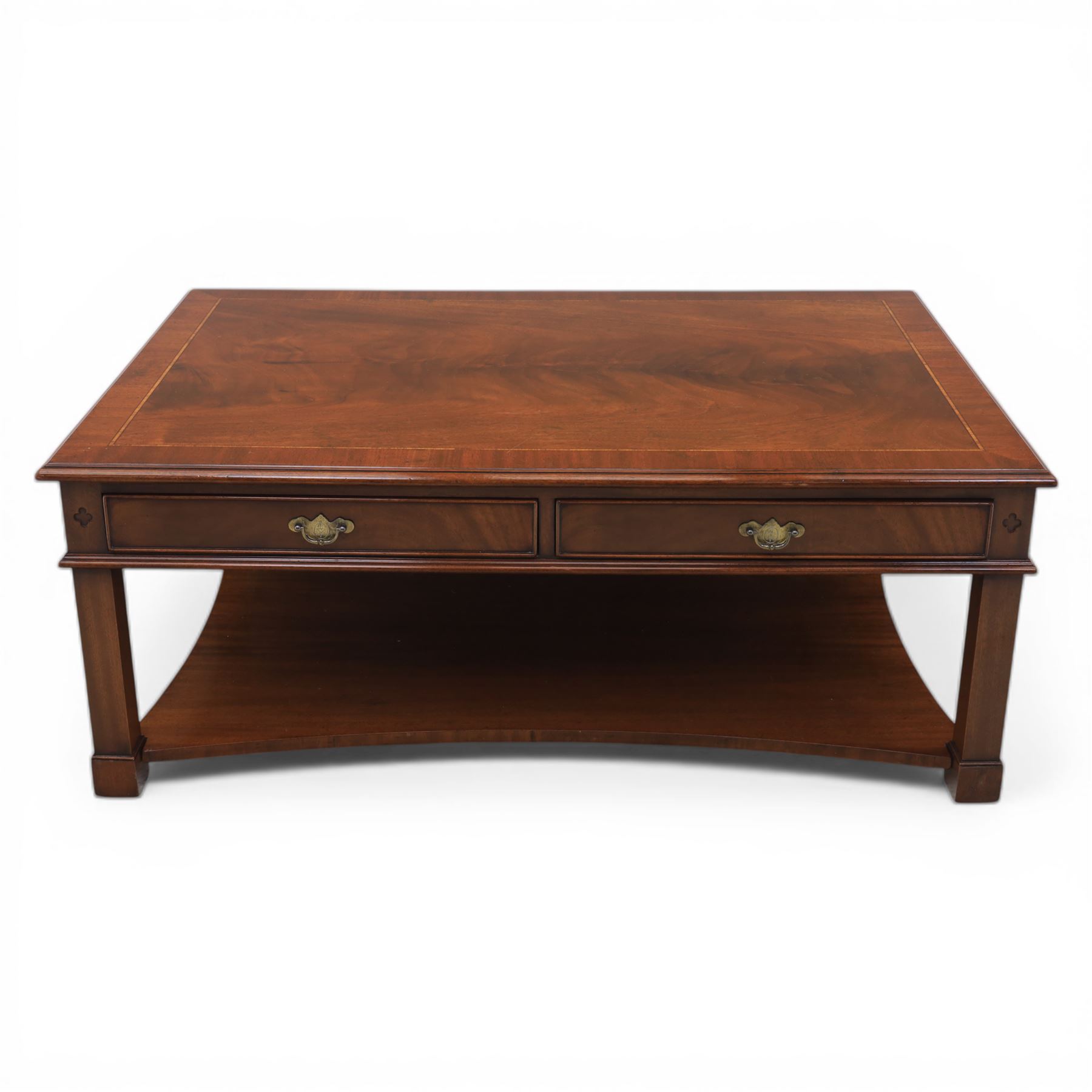 Georgian style mahogany coffee table, rectangular moulded top with crossbanded border and line inlay, fitted with two cock-beaded frieze drawers with ornate brass swan neck handles and shaped backplates, opposing false drawer fronts, raised on square tapering supports united by a concave undertier