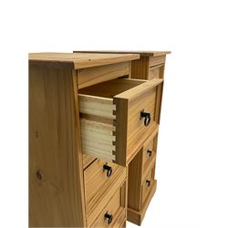 Pair of pine four drawer pedestal chests, black iron handles