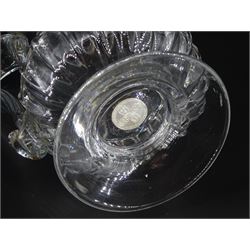 Early 19th century glass tankard, with part fluted base and ribbed band to rim, upon a spreading circular foot enclosing a silver George IV shilling, H19.5cm