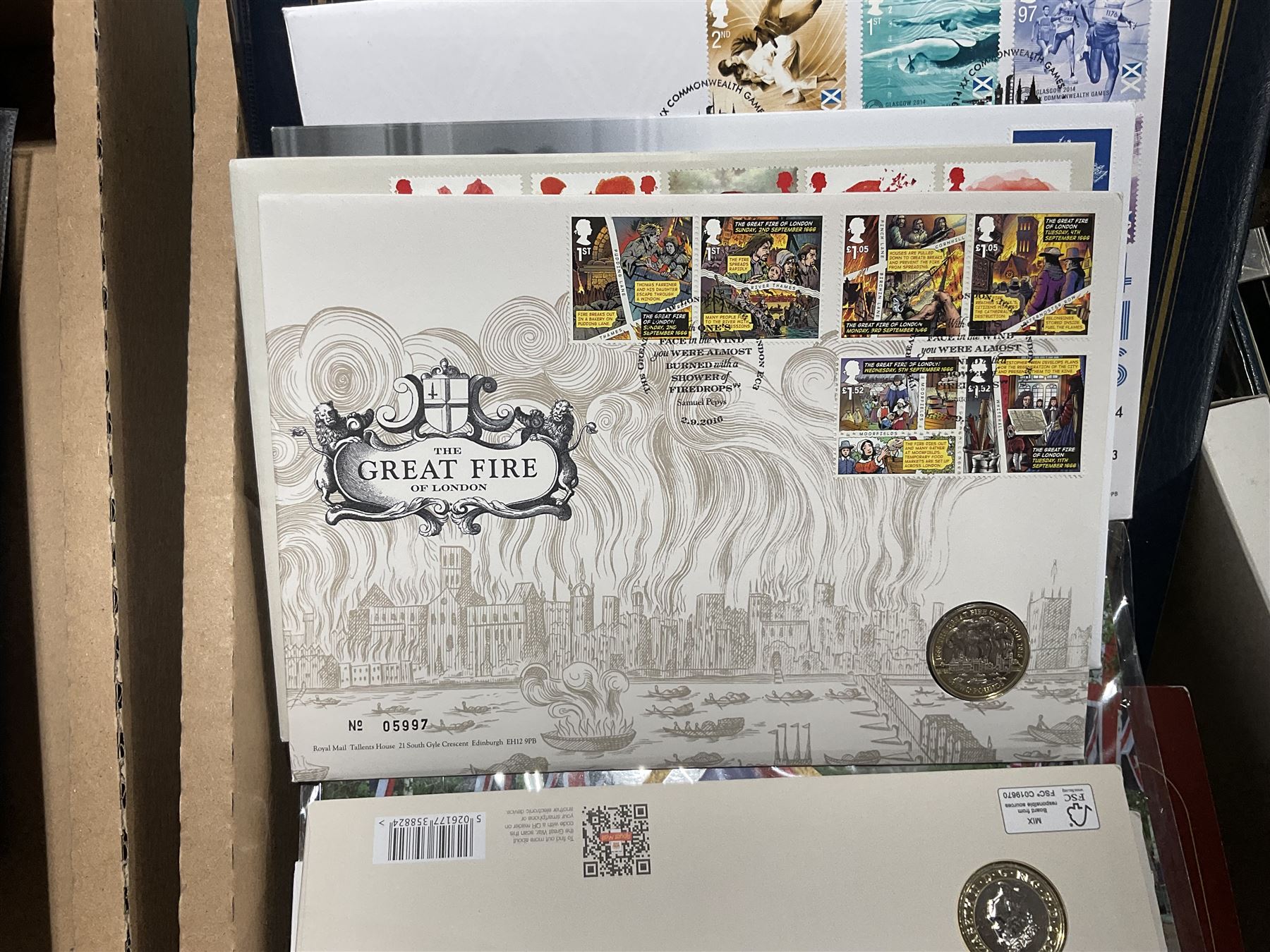 Approximately one hundred and fifteen Royal Mint coin covers, in two ring binder folders and loose, together with approximately 53 grams of Great British pre-1920 and approximately 68 grams of Great British pre-1947 silver threepence coins, and a small quantity of further pre-decimal coins