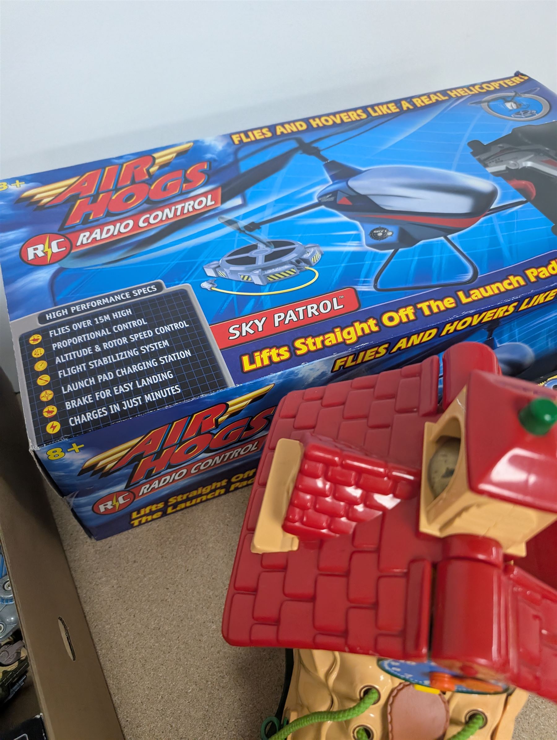 Collection of toys, including Matchbox Old Mother Hubbard's shoe, Tomy Zoids Blade Liger, Air Hogs radio controlled helicopter, diecast tanks etc, 