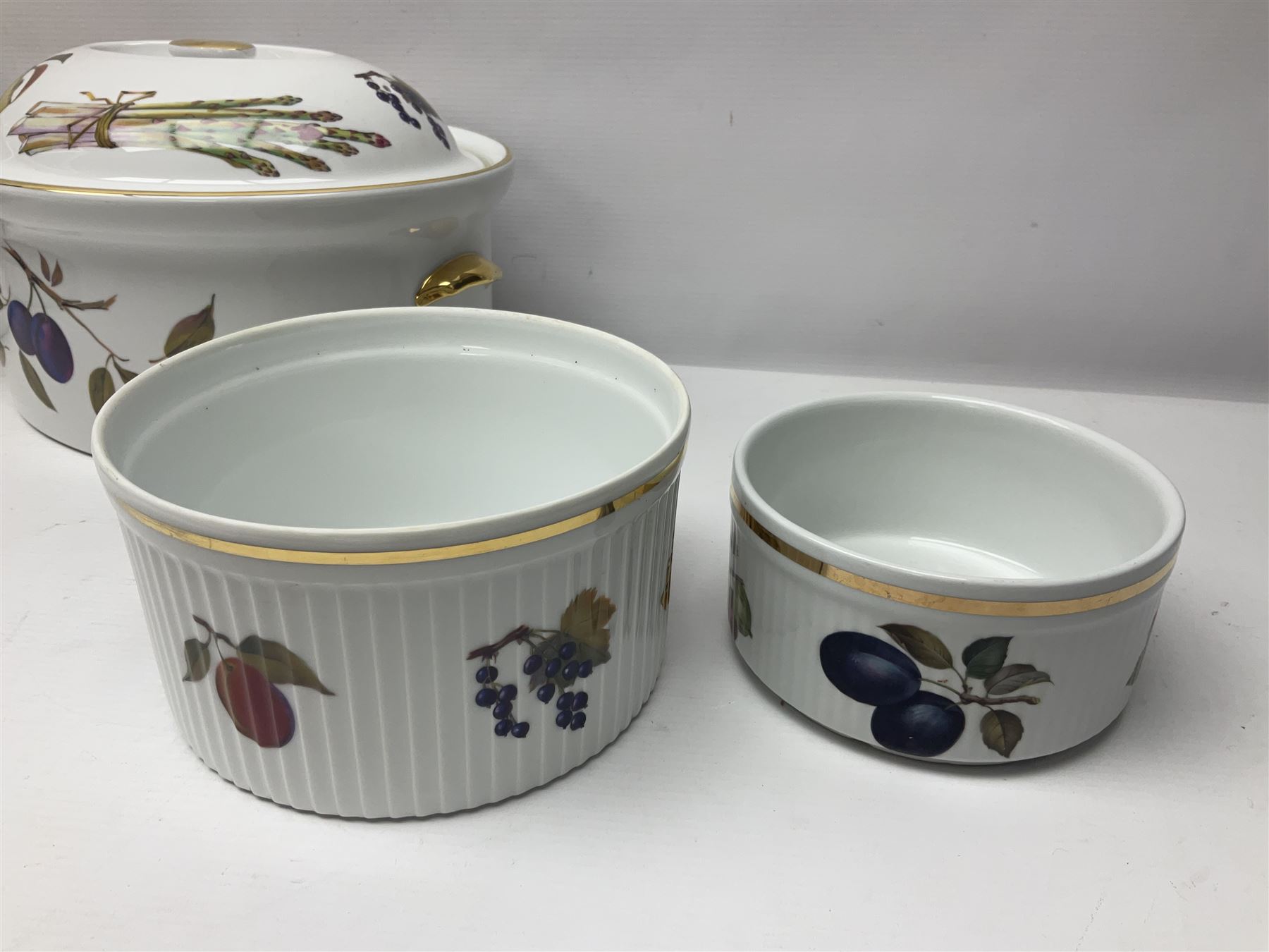 Royal Worcester Evesham pattern, including covered pot de cremes, twin handle tureen, serving dishes, flan dishes, side plates etc  