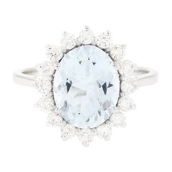 18ct white gold aquamarine and diamond cluster ring, single oval cut aquamarine of approx ...