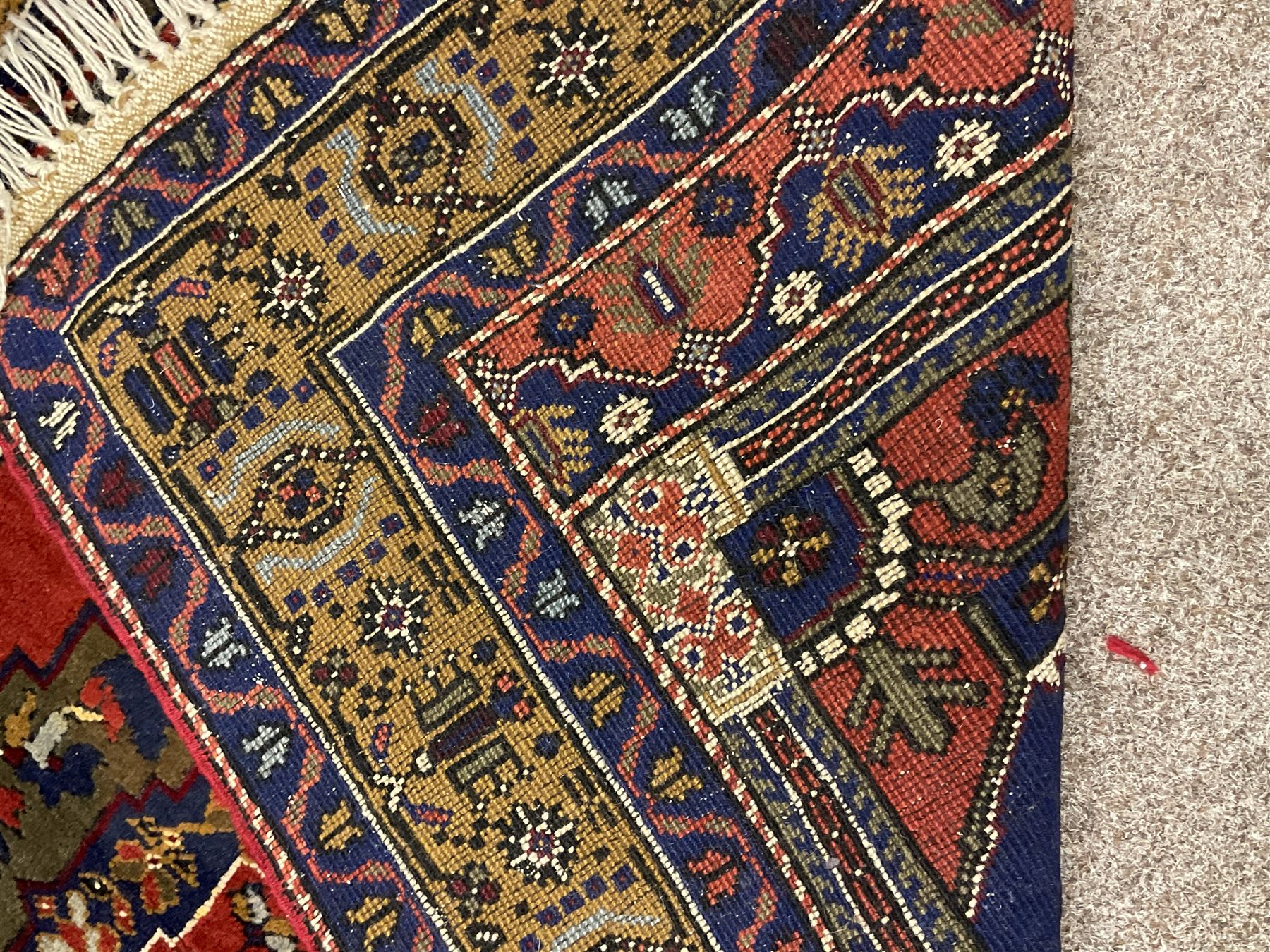 Turkish Taspinar rug, blue ground with central lozenge and medallion, the outer borders decorated with stylised motifs