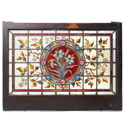 Victorian Aesthetic movement stained glass leadlight window panel, the central panel hand painted with a sprig of daffodils, the surrounding panels profusely decorated with branches and leaves, overall 62cm x 84cm 
