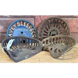Four late 19th / early 20th century cast iron farm implement seats, Kearsley & Co. of Ripon, Davey Sleep & Co. Nicholson, and a Batavia USA, largest W33cm (4) - COLLECTION BY APPOINTMENT FROM: The White House, Thirsk Road, Easingwold, York, YO61 3NF - CALL 01723 507111 TO ARRANGE