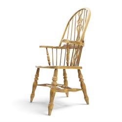 Traditional elm Windsor armchair, hooped spindle back with pierced splat, shaped elm seat, on turned supports united by double H stretcher, turned supports