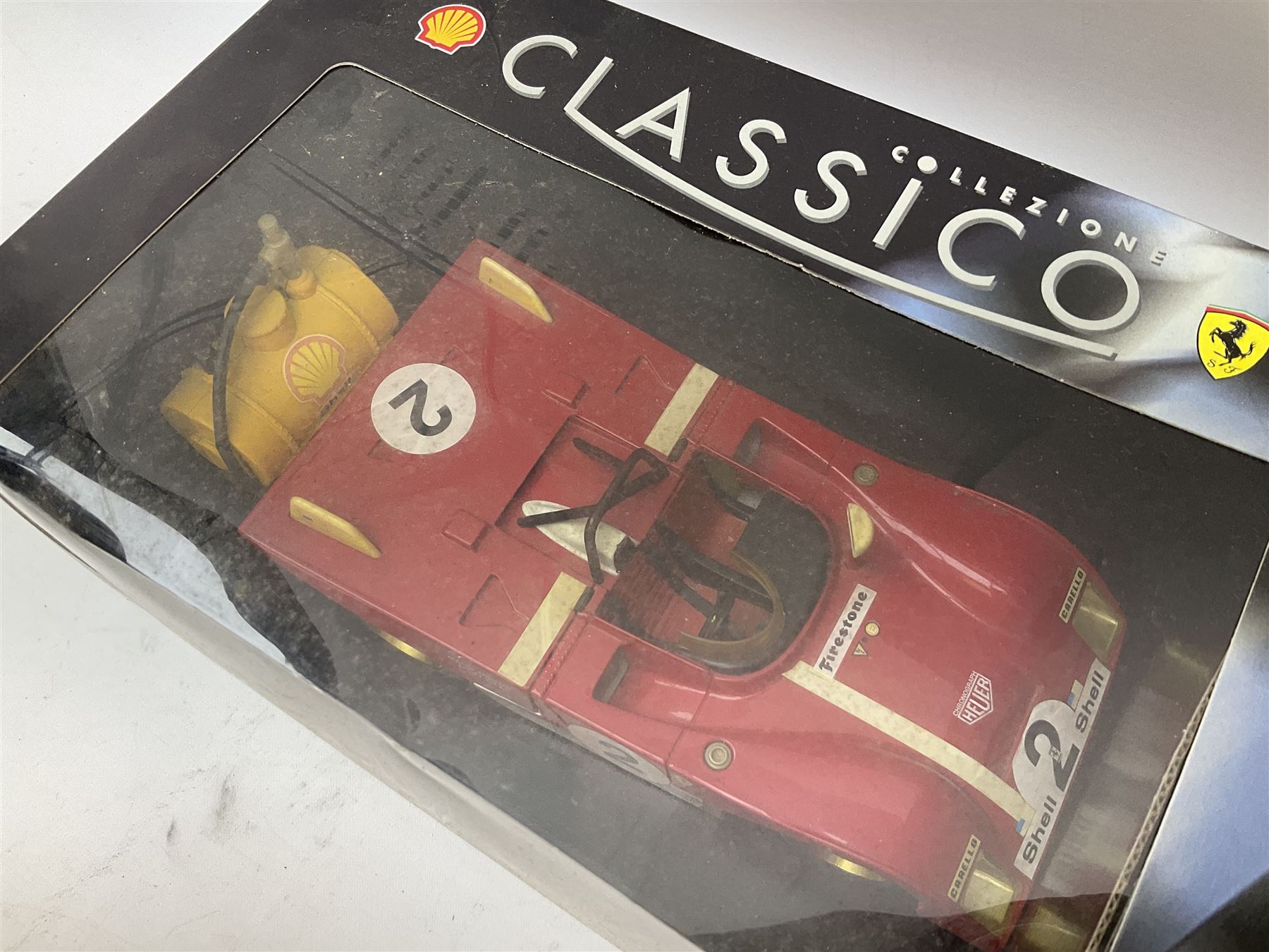 Two Collezione Classico large scale die-cast models of a Ferrari 1972 312P with Racing Fuel Pump and Ferrari 1958 250 Testa Rossa with Road Fuel Pump; and two Minichamps 1:18 scale models of a McLaren Mercedes Racing Car and Auto Union Typ C racing car; all boxed (4)