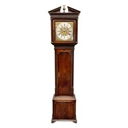 Early 19th century oak and mahogany banded longcase clock, the sloped arch and dentil pediment with central finial above blind fret work frieze, square brass dial with silvered Roman and Arabic chapter ring signed ‘Barker, Wigan’, ornate gilt metal spandrels, subsidiary seconds dial and calendar aperture, dial size - 32.5cm x 32.5cm, shaped arch trunk door flanked by fluted quarter columns, eight day movement striking on bell