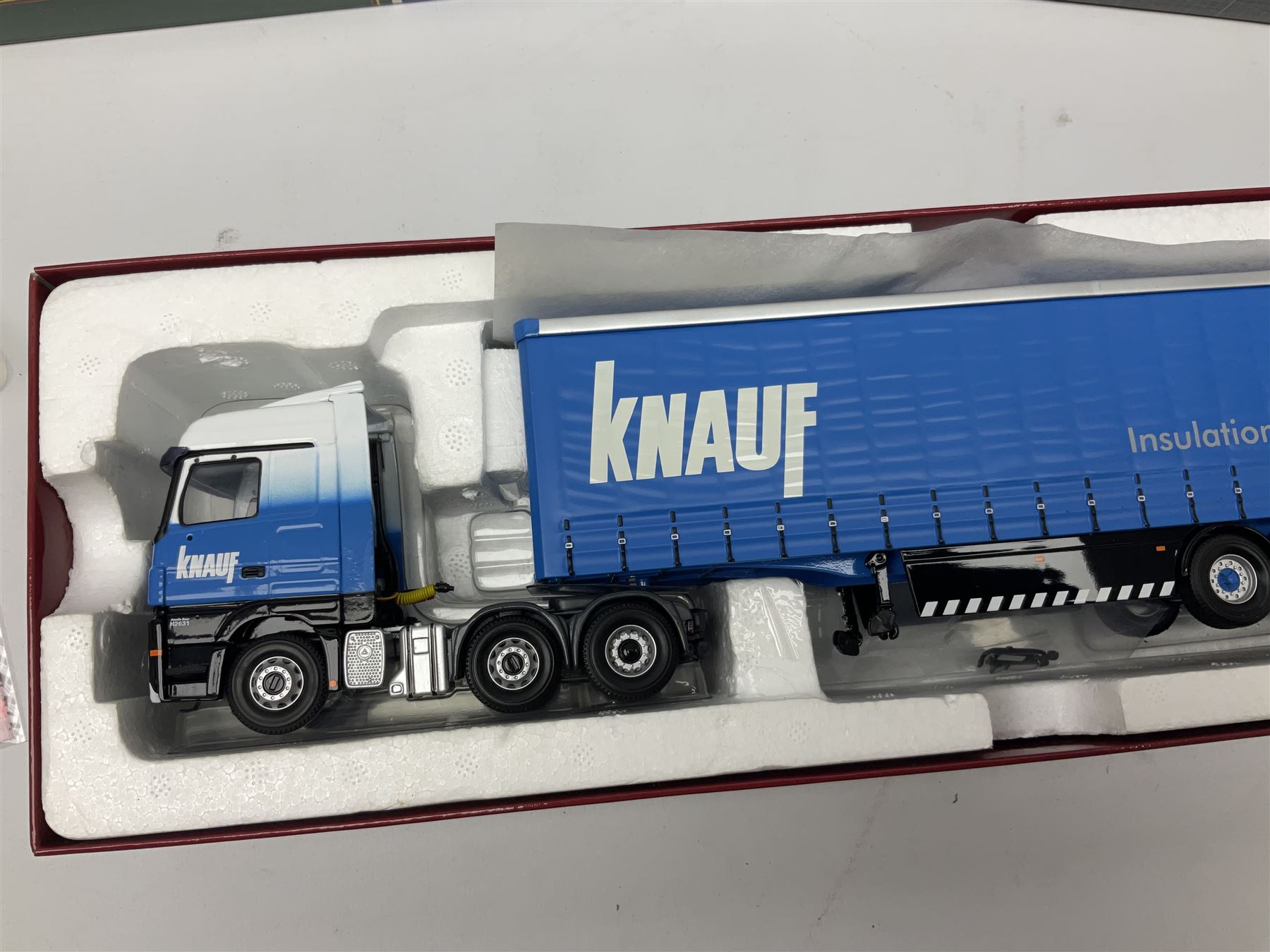 Corgi Eddie Stobart - three limited edition lorries; CC12936 Sight & Sounds Scania Topline Curtainside Trailer; CC13812 Hauliers of Renown Mercedes-Benz Actros Curtainside Knauf; and CC13405 MAN TGA XL Step Frame Curtainside Trailer; all boxed (3)