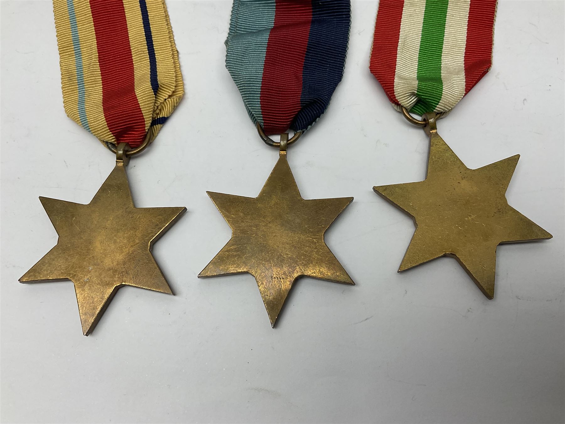 Group of five WWII medals comprising 1939-45 War Medal, Defence Medal and Italy, Africa and 1939-45 Stars; all with ribbons (5)