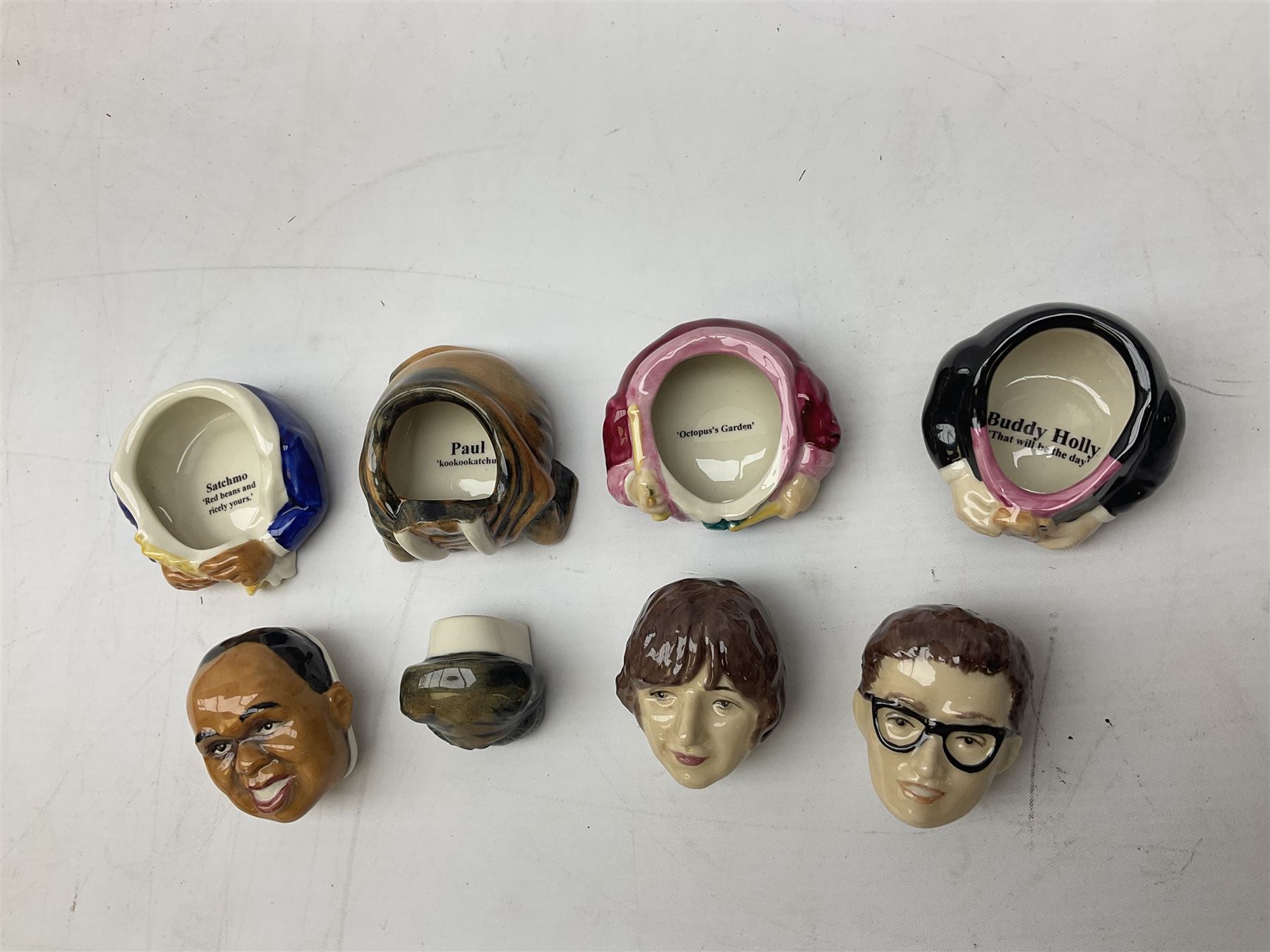 Fifteen Face Pots by Kevin Frances, all of music interest, to include the Beatles; Paul 'Kookoocachu', 'Love Is All You Need', 'Octopus's garden', 'While My Guitar Gently Weeps', 'All You Need Is Love' and 'Everybody's talking and no one says a word', Elton John; I'm still standing, Buddy Holly; 'That will be the day', David Bowie 'We can be heroes' , Mick Jagger prototype colour type etc, all boxed  