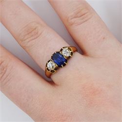 Victorian 18ct gold three stone oval cut sapphire and old cut diamond ring, Birmingham 1895, sapphire approx 0.90 carat, total diamond weight approx 0.55 carat