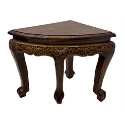 Early 20th century Chinese hardwood nesting coffee table, oval top carved with figures and traditional pagoda scenes with carved frieze, complete with six inset stools or side tables, raised on tapering supports with paw feet