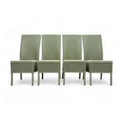 Set of four Lloyd Loom dining chairs, each with woven high back and seat in sage green finish, raised on matching painted tubular supports