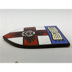 Henry George Murphy (1884-1939), Arts & Crafts enamel panel, of shield form, decorated with a red cross, upon a white ground, with a central flower, H7cm, W6cm