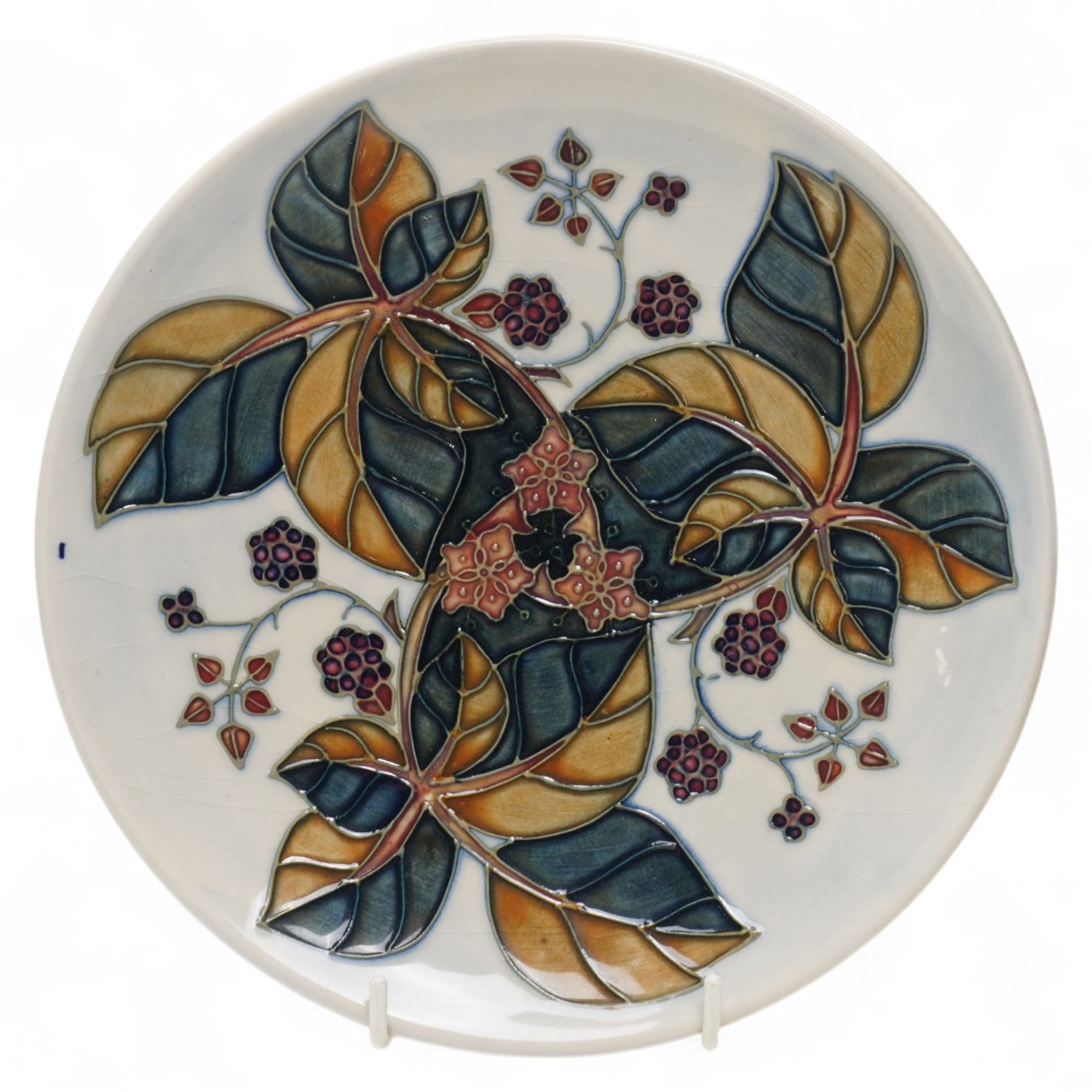 Moorcroft plates, to include the 1996 Year Plate limited edition number 106/500, with certificate, and two Brambles pattern plates, each with impressed and painted marks to base, D22cm (3)