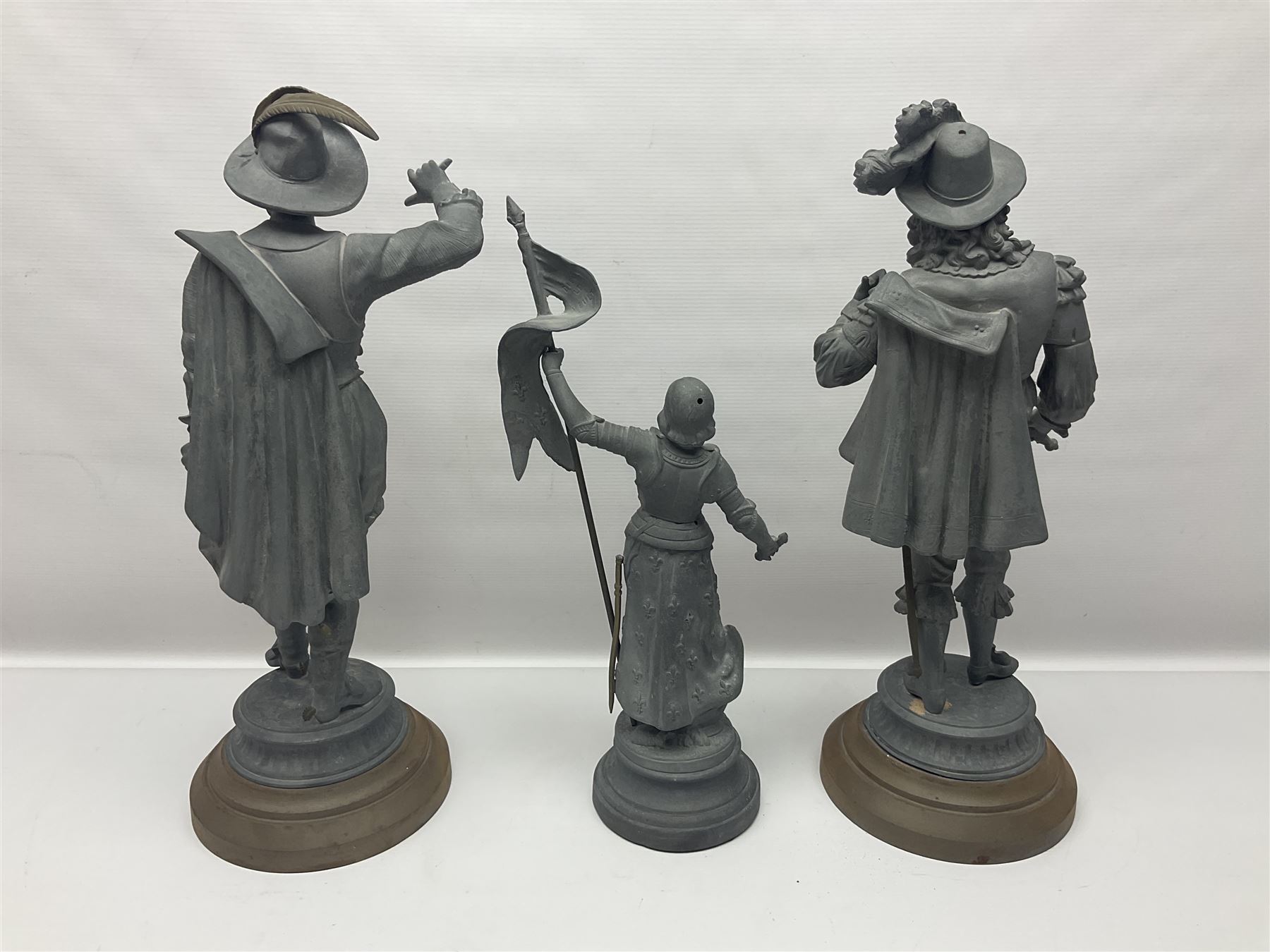 Pair of spelter figures modeled as Cavaliers, together with a spelter figure of Joan of Arc, largest H52cm