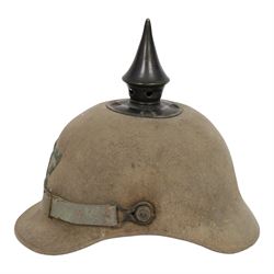 WWI Prussian 57th regiment Ersatz felt Pickelhaube, the grey felt skull with steel spike finial, stitched with green felt 57, chin strap, one side with a black cockade, the other black and red