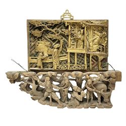 Two carved oriental wall hangings, the f