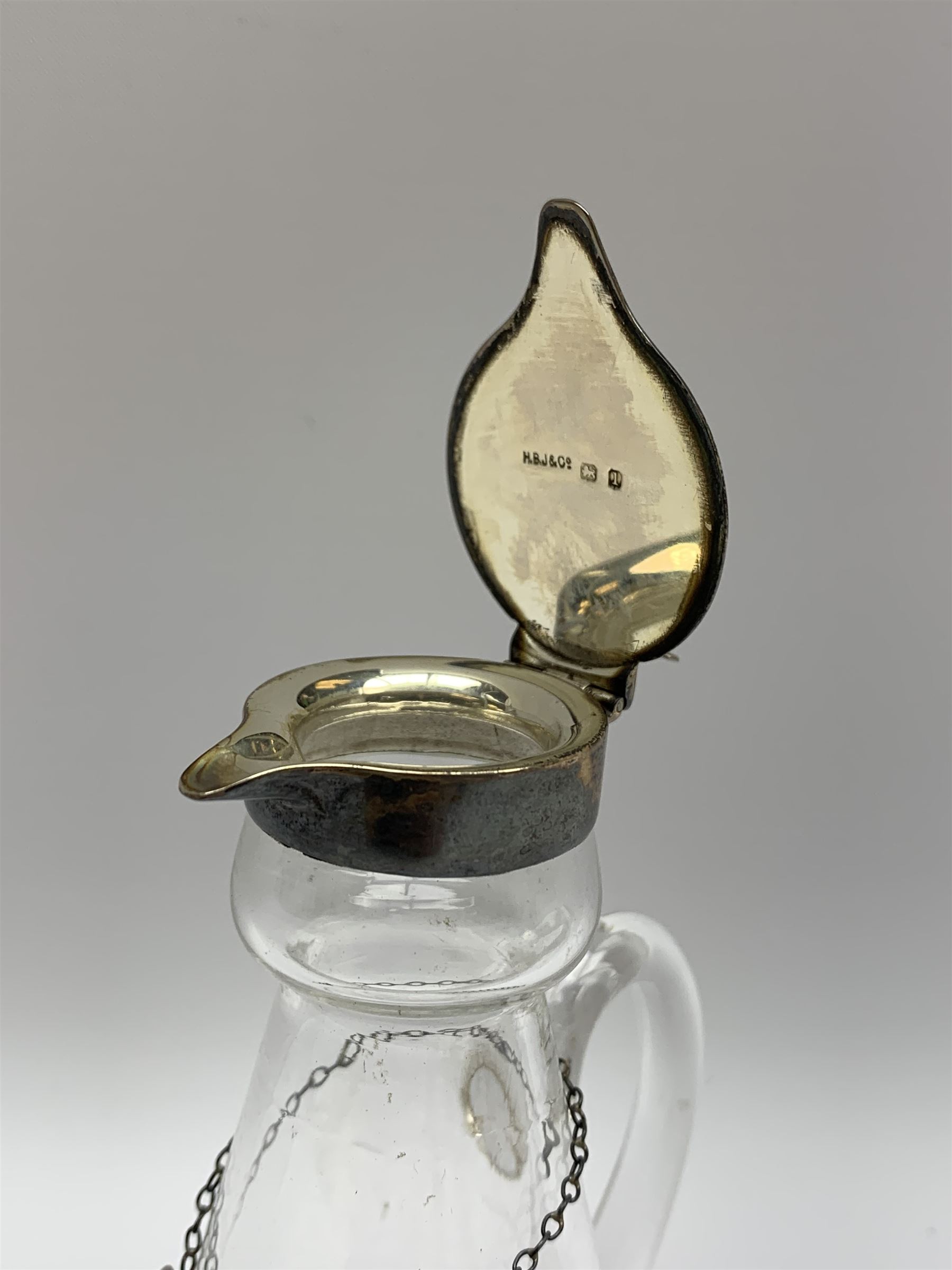 Edwardian silver mounted whisky noggin, of tapering cylindrical form with hinged flat cover, H12cm, together with a silver whisky label, each hallmarked H B Johnson & Co, London, whisky noggin dated 1906, label 1910
