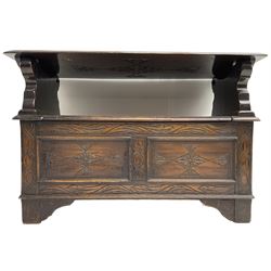 17th century design stained oak monks bench, hinged metaphoric table back, over hinged box seat compartment, the panelled front carved with foliate decoration and lozenges