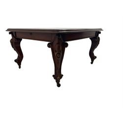 Victorian mahogany extending dining table, moulded rectangular top with rounded corners, telescopic mechanism with leaf and winding handle, on leaf and cartouche carved cabriole supports, brass and ceramic castors