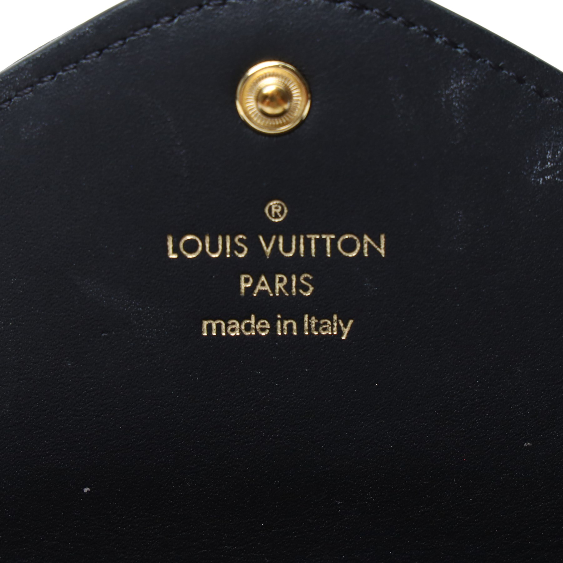 Louis Vuitton - ‘New Wave’ Long Wallet in black quilted calf leather, the envelope flap with oversized gold-tone LV logo and press-stud fastening, with detachable wrist strap detailed in multicoloured Louis lettering and Monogram flowers, opening to a fitted leather interior with twelve card slots, two compartments and zipped pocket, with care booklet and box