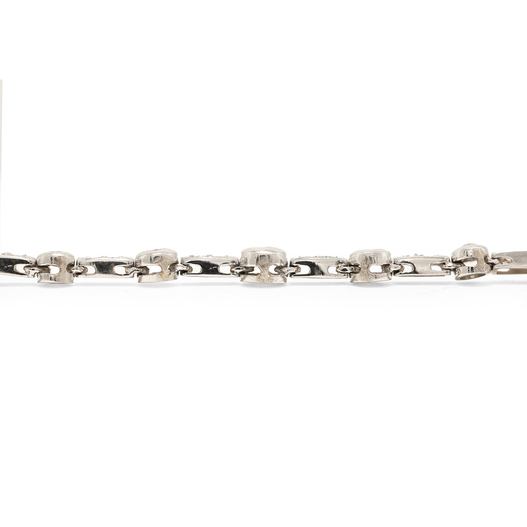 18ct white gold diamond necklace, bezel set with a single round brilliant cut diamond, spaced by two further diamonds, to a rectangular link necklace, London 2000, total diamond weight approx 0.75 carat