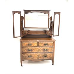 Late Victorian walnut triple mirror back dressing chest, two trinket drawers above two short an two long drawers, shaped apron, square tapering supports 