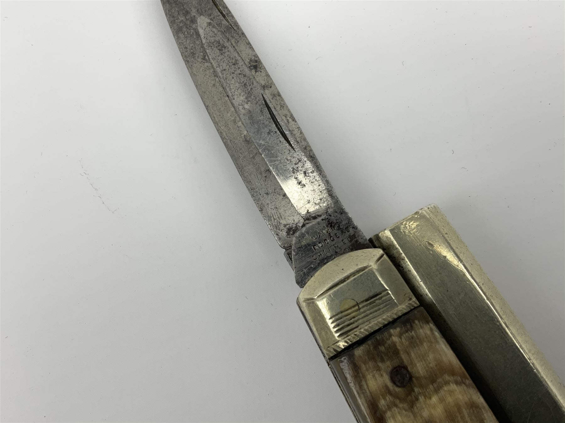 Mid-19th century James Rodgers Sheffield 160-bore (approx. 25cal.) percussion knife pistol with twin folding blades, known as 'Unwin & Rodgers Type', 9cm nickel tapering octagonal barrel with rear mounted nipple, boxlock central hammer action, smooth horn riveted side scales with nickel mounts housing nickel scissor action bullet mould, pair of tweezers and concealed butt compartment for ball/cap, folding trigger and two blades, one 8cm dagger style and one 5.5cm single edged utility blade L17.5cm overall closed