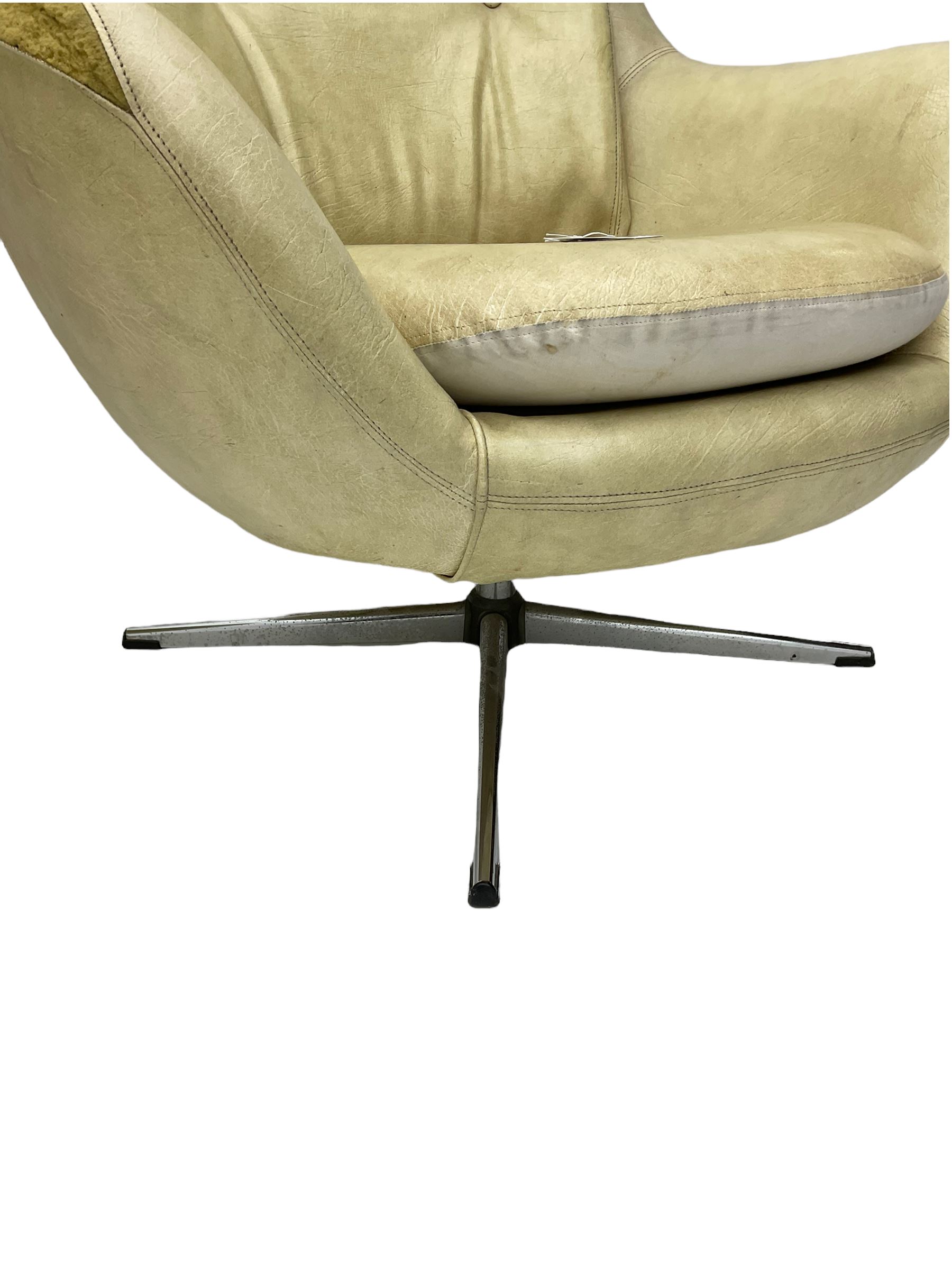Parker Knoll - pair of swivel statesman chairs, circa. 1960s
