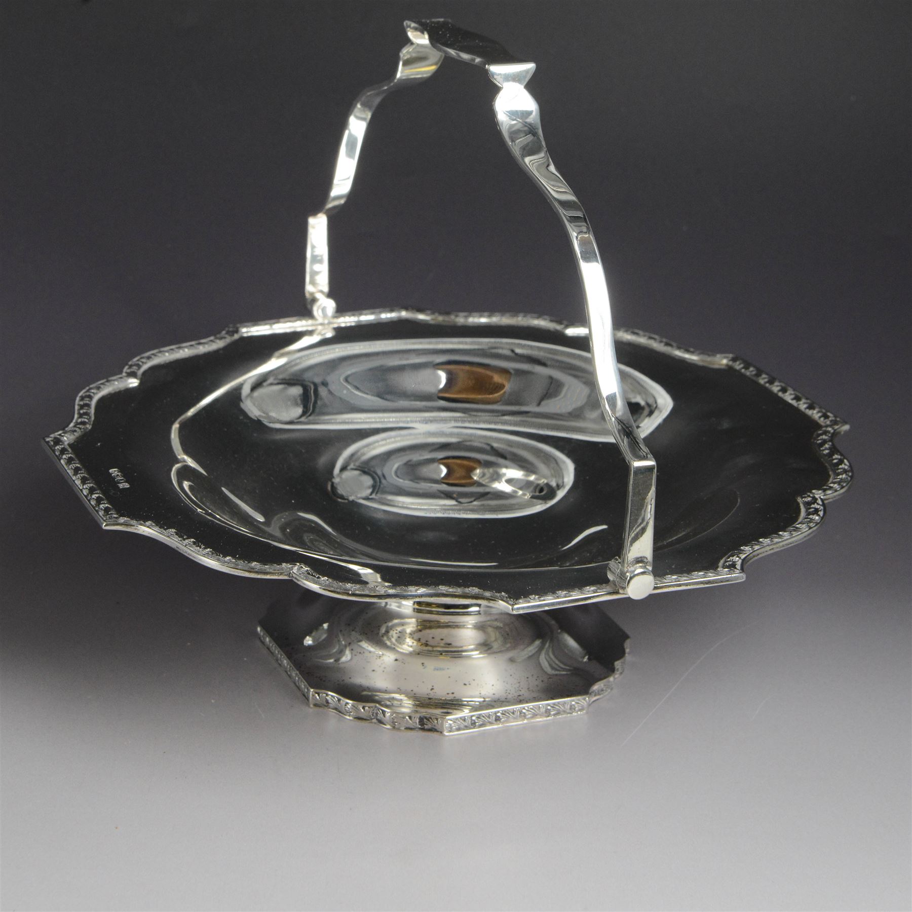 1920s silver swing handled pedestal dish, of octagonal form with shaped rim and foliate border, upon a similar pedestal, hallmarked Cooper Brothers & Sons Ltd, Sheffield 1922, not including handle H7cm