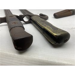 WWI Remington Pattern 1913 bayonet, the 43cm fullered blade with various marks to the ricasso including date code 11 16; in leather covered scabbard with various stamps including JWB 17 L58cm overall; and a French Model 1866 sabre bayonet (no scabbard)