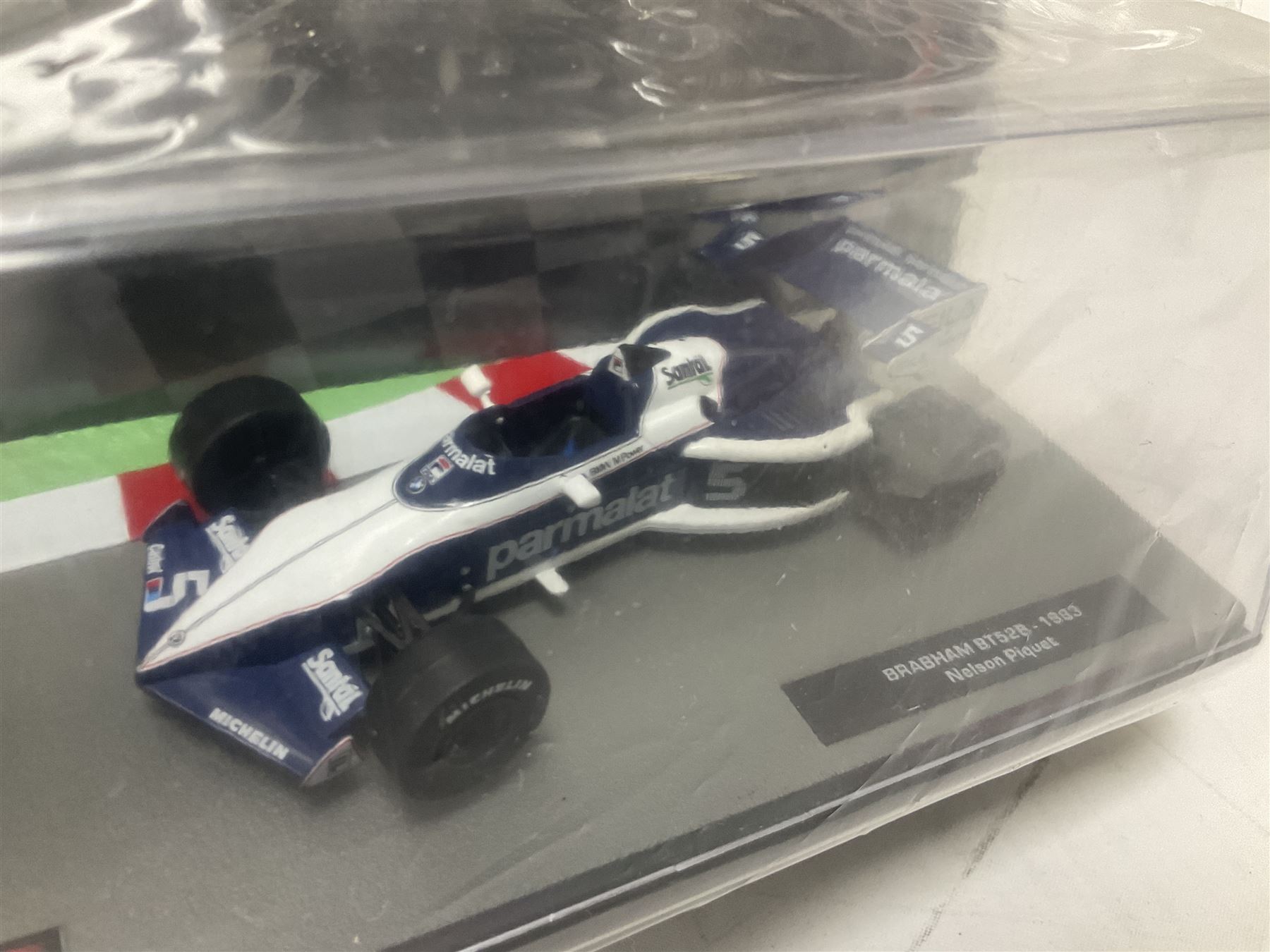 Panini Formula 1 The Car Collection - twelve die-cast models including ten in unopened packaging with periodical; all models in plastic display boxes; and eight other boxed die-cast models of racing cars by Corgi, Onyx, Classico, Minichamps etc (20)