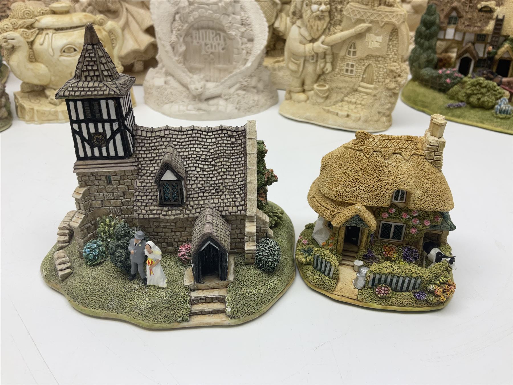 Thirty three Lilliput Lane models from the British collection and paint your own Children's Plaques, to include I am a little teapot, Gnome improvements, Dennis the Dragon, Bill and Ben, The Bobbins etc, some with boxes and deeds 