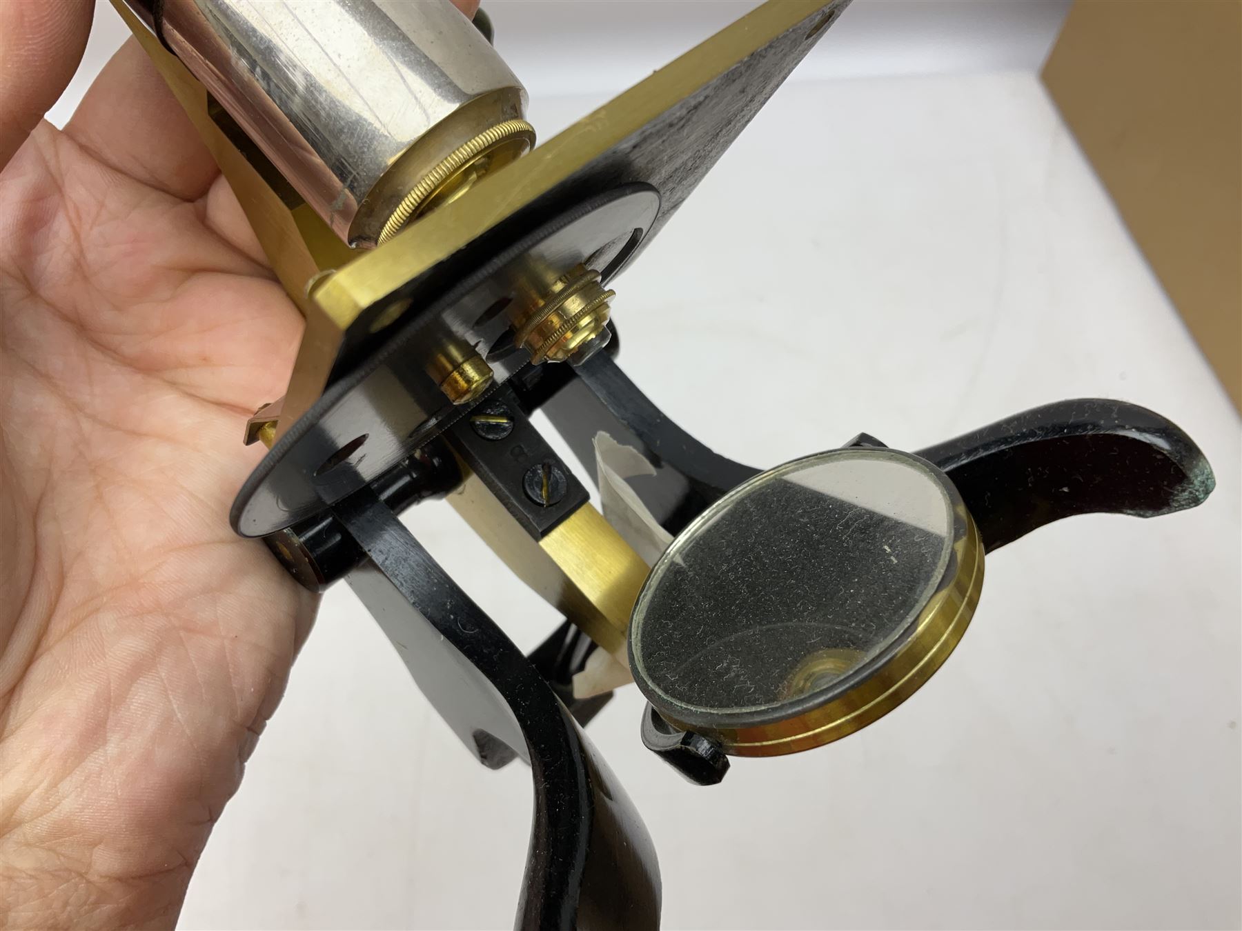  Brass field microscope, together with a cased microscope and twenty five microscope slides