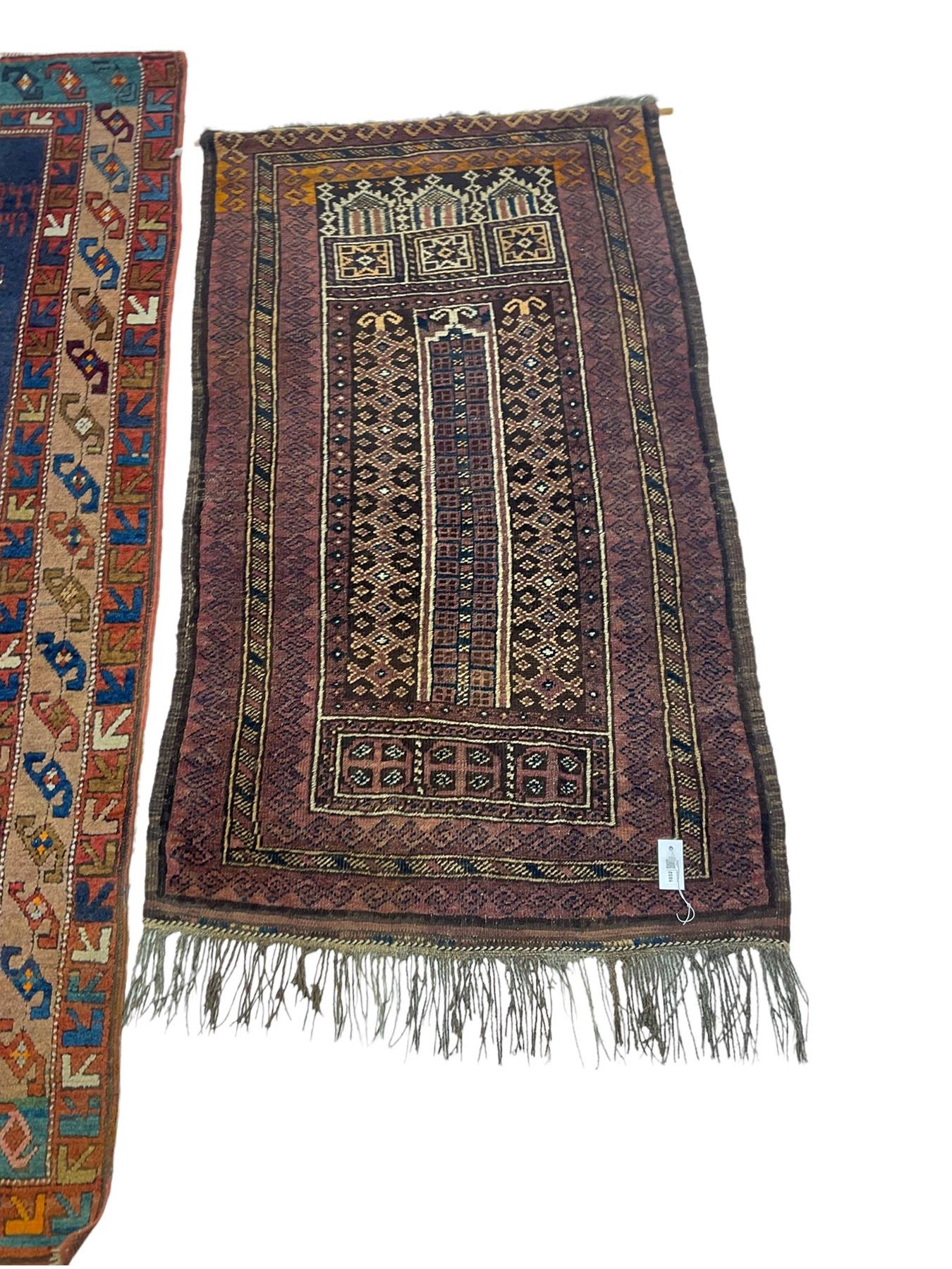 Turkish rug or wall hanging, blue ground field with decorative panels, with geometric motifs and multi-band border (207cm x 104cm), and a prayer rug with repeating border and geometric motifs (150cm x 92cm)
