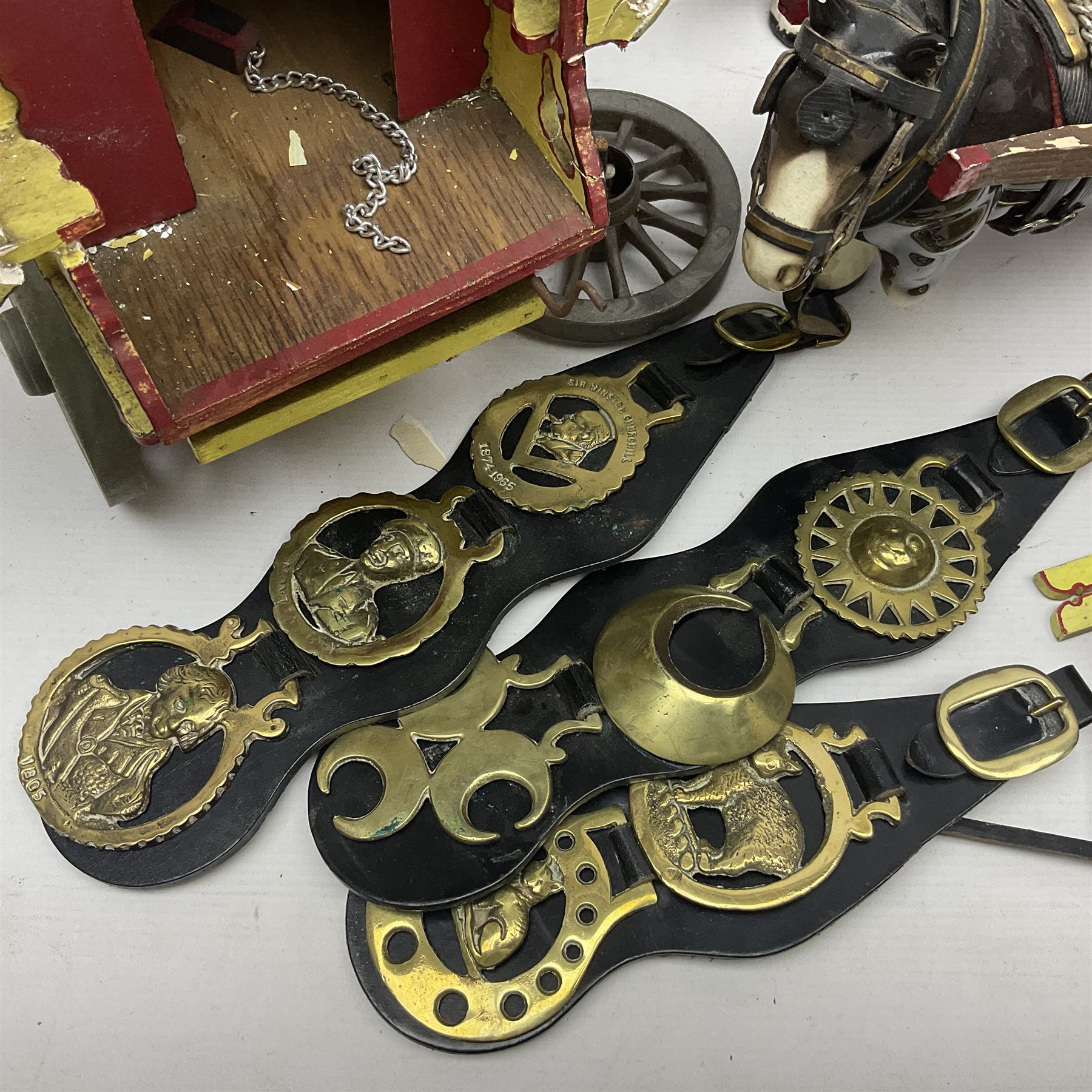 Two ceramic shire horse and gypsy caravans, together with horse brasses 