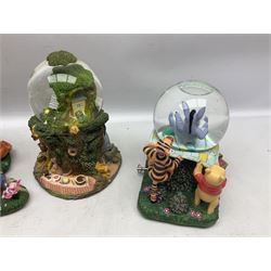 Five Disney Winnie The Pooh snow globes to include The Rain Rain Rain Came Down Down Down, Eeyore Pulling Cart, Owl's House, Rumbly in My Tumbly and Stuck In Rabbit's House, together with figure group with dome, five with boxes (6)