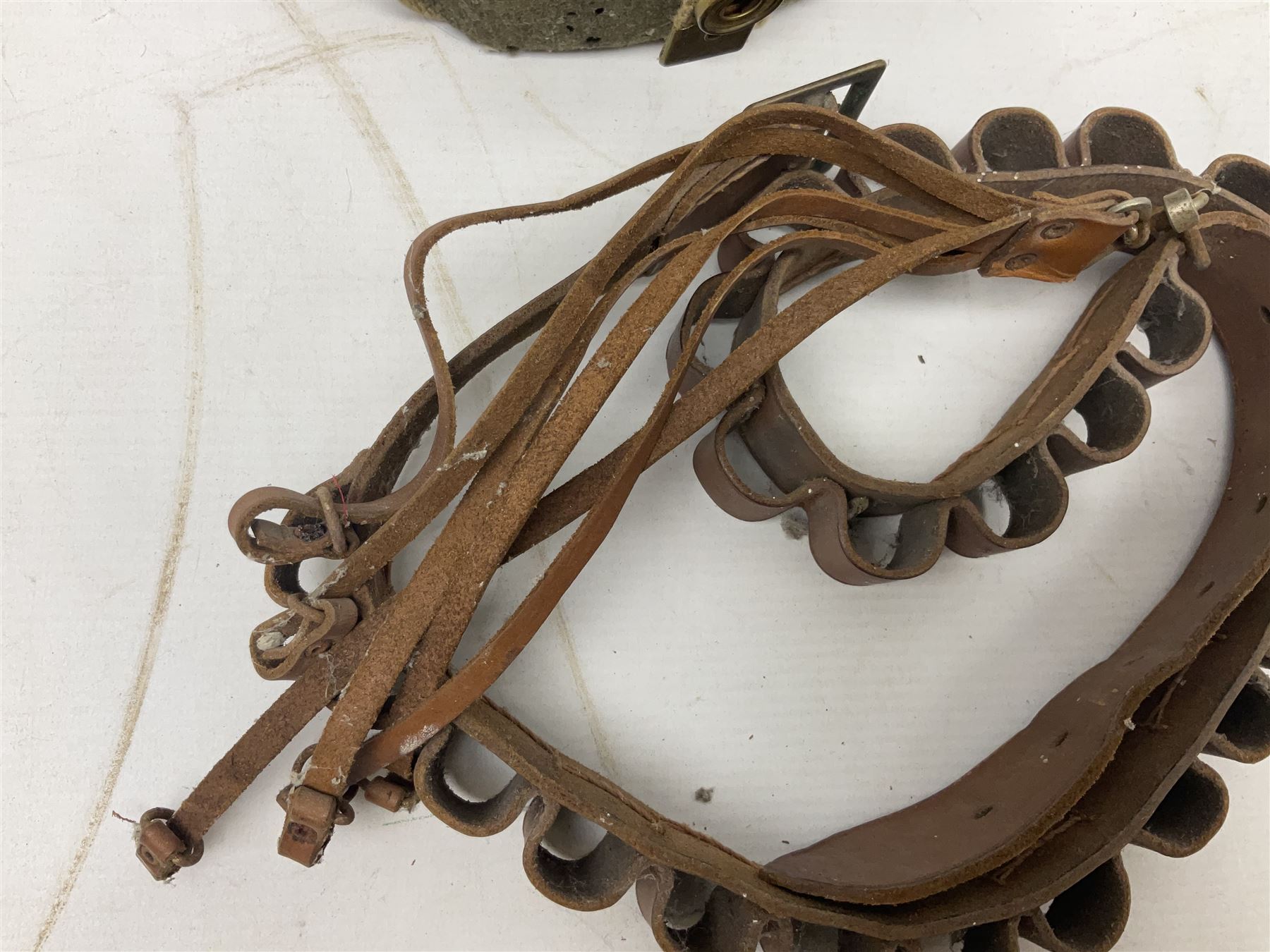 Mundial Brazil bowie knife, the 15.5cm steel blade inscribed 'Sheriff Knife', with banded and aluminium hilt; in leather sheath L29cm overall; British Army felt covered metal water bottle with webbing strap; leather 12-bore cartridge belt; and small pair of non-military binoculars in part case (4)