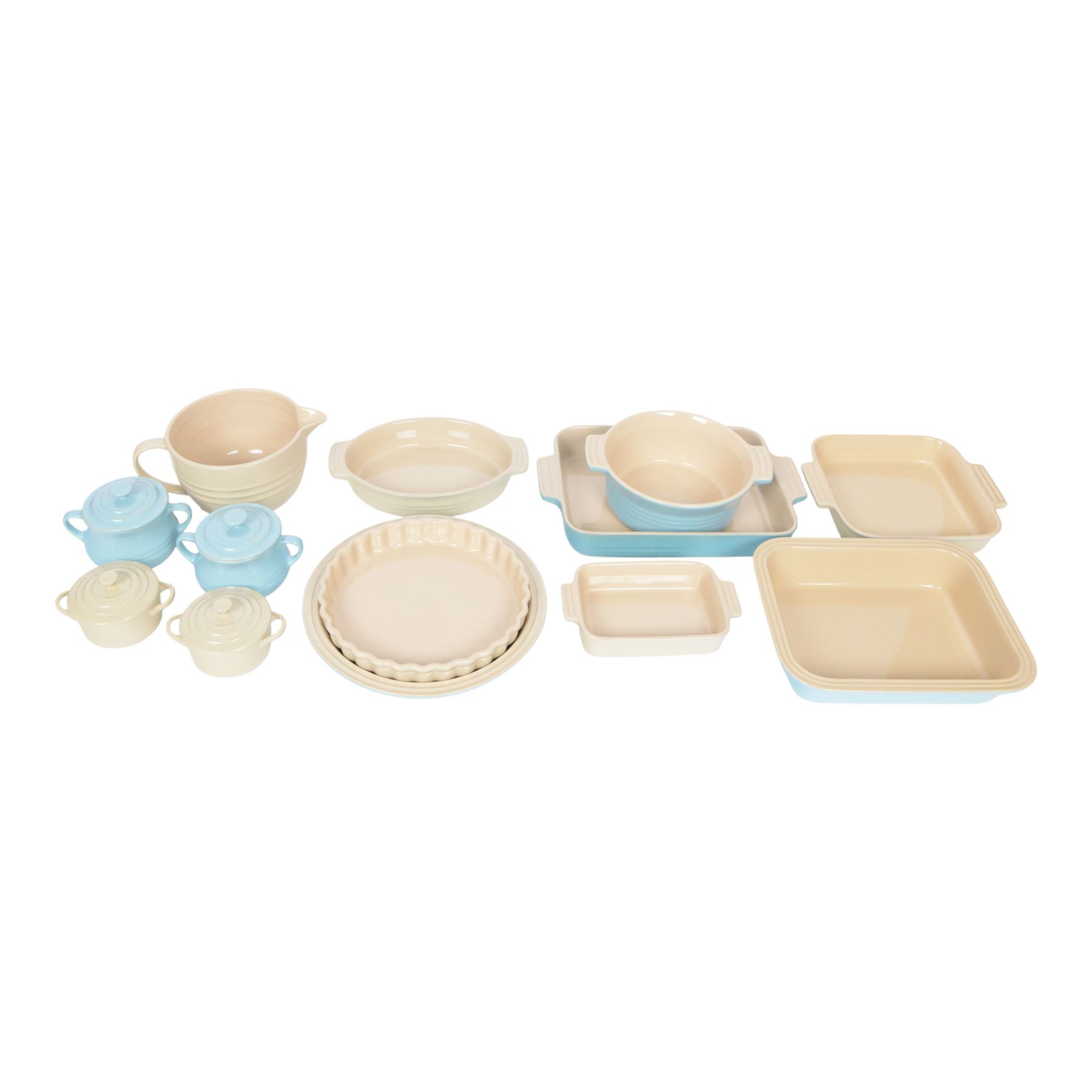Le Creuset ceramic kitchen wares in cream and light blue, including pie dishes, baking dishes, petit casseroles etc  
