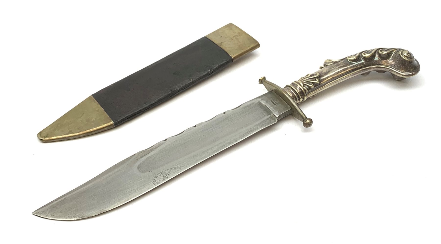 Large Bowie knife, the 20cm steel blade marked R. Coope(r?) Sheffield England, with plated crosspiece and pistol grip embossed with scrolls and anthemion, in plated and leather scabbard L33cm overall