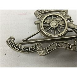Third Middlesex Royal Garrison Artillery Volunteers Cap Badge, white meta Royal Artillery cap badge with “THIRD” to the top scroll and lower three part scroll “MIDDLESEX – R.G.A. – VOLUNTEERS”. Three lug fittings to the reverse.