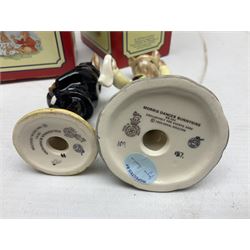 Royal Doulton The Mickey Mouse Collection Pluto figure, Coalport Characters The Snowman Dressing Up figure, three Royal Doulton Bunnykins figures comprising Policeman, Morris Danger and Eskimo, and display stand, Royal Doulton John Beswick Tiggy Winkle, Royal Albert Beatrix Potter Peter Postbag and three Goebel Hummel figures, all boxed