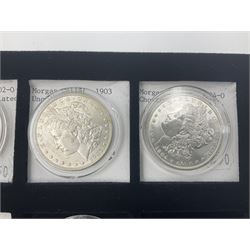 Seven United States of America silver Morgan dollar coins, dated 1884, 1901 O, 1902 O, 1903, 1904 O, 1921 D and 1921