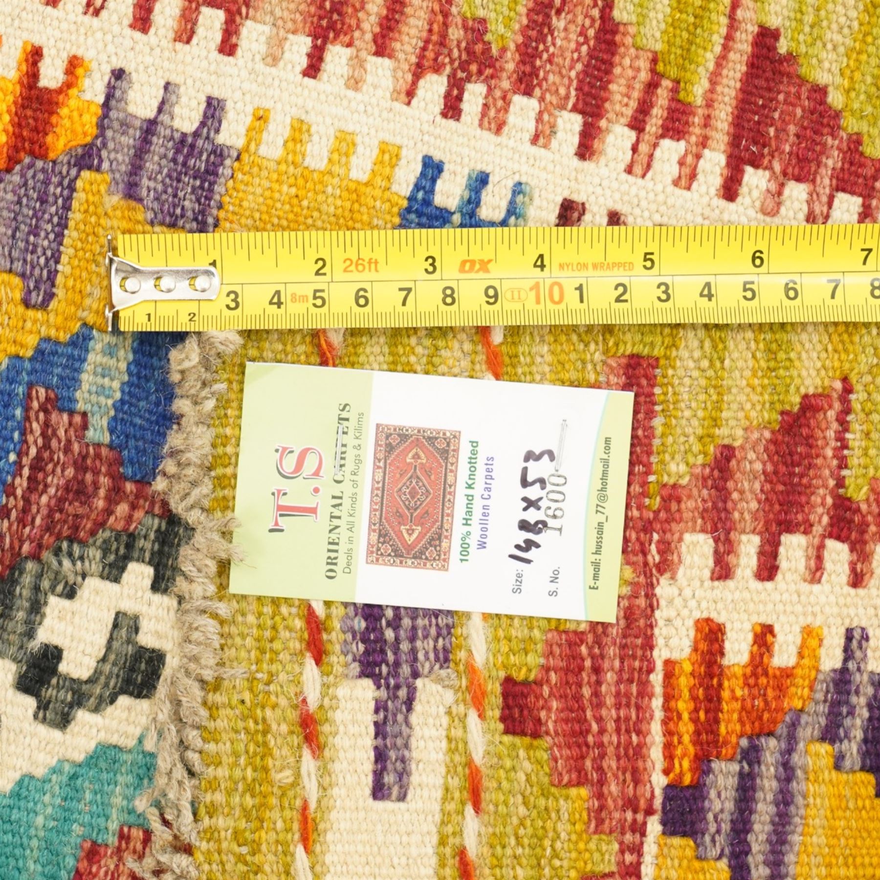 Afghan Chobi flatweave kilim and an Afghan Chobi flatweave kilim runner, with a repeating stepped diamond medallion design in ivory, green, rust, teal, purple, and indigo, framed by chevron and geometric borders, 148x53cm & 129x80cm, (2)