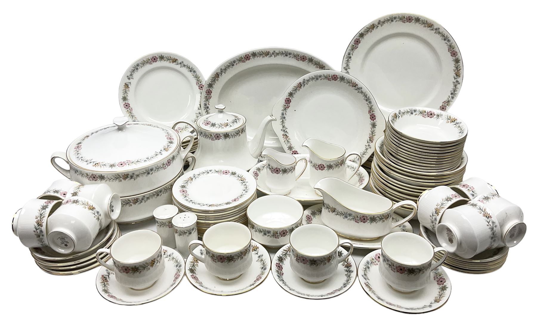 Royal Albert Paragon tea and dinner service for twelve decorated in the Belinda pattern, comprising fourteen saucers, twelve teacups, thirteen side plates, teapot, sauce boat and stand, salt and pepper shakers, two jugs, sucrier, twelve dinner plates, twelve smaller plates, two lidded tureens, twelve bowls, twelve smaller bowls, cake plate, oval plate and oval dish (100)